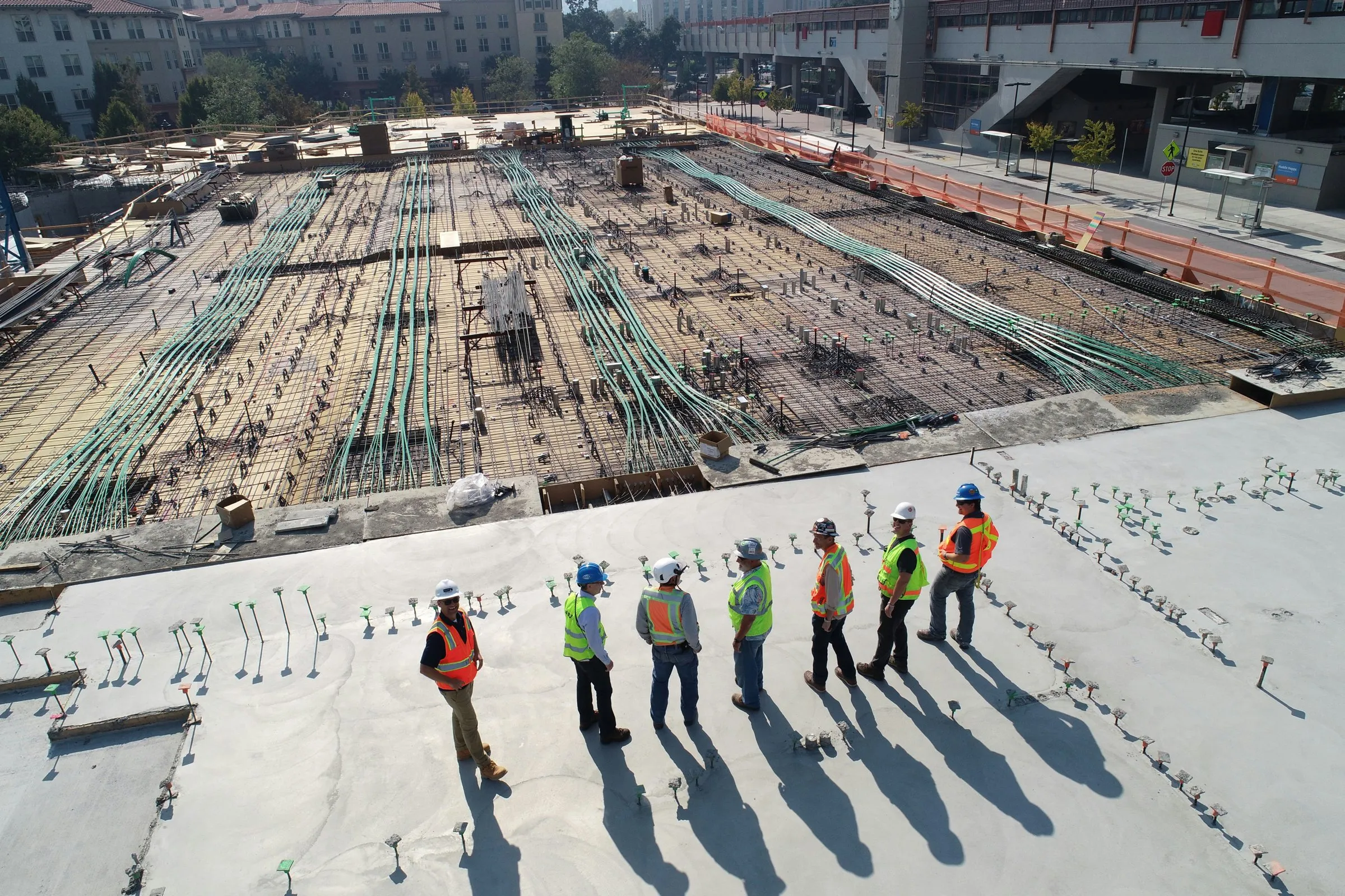 A site team walking out a large construction slab